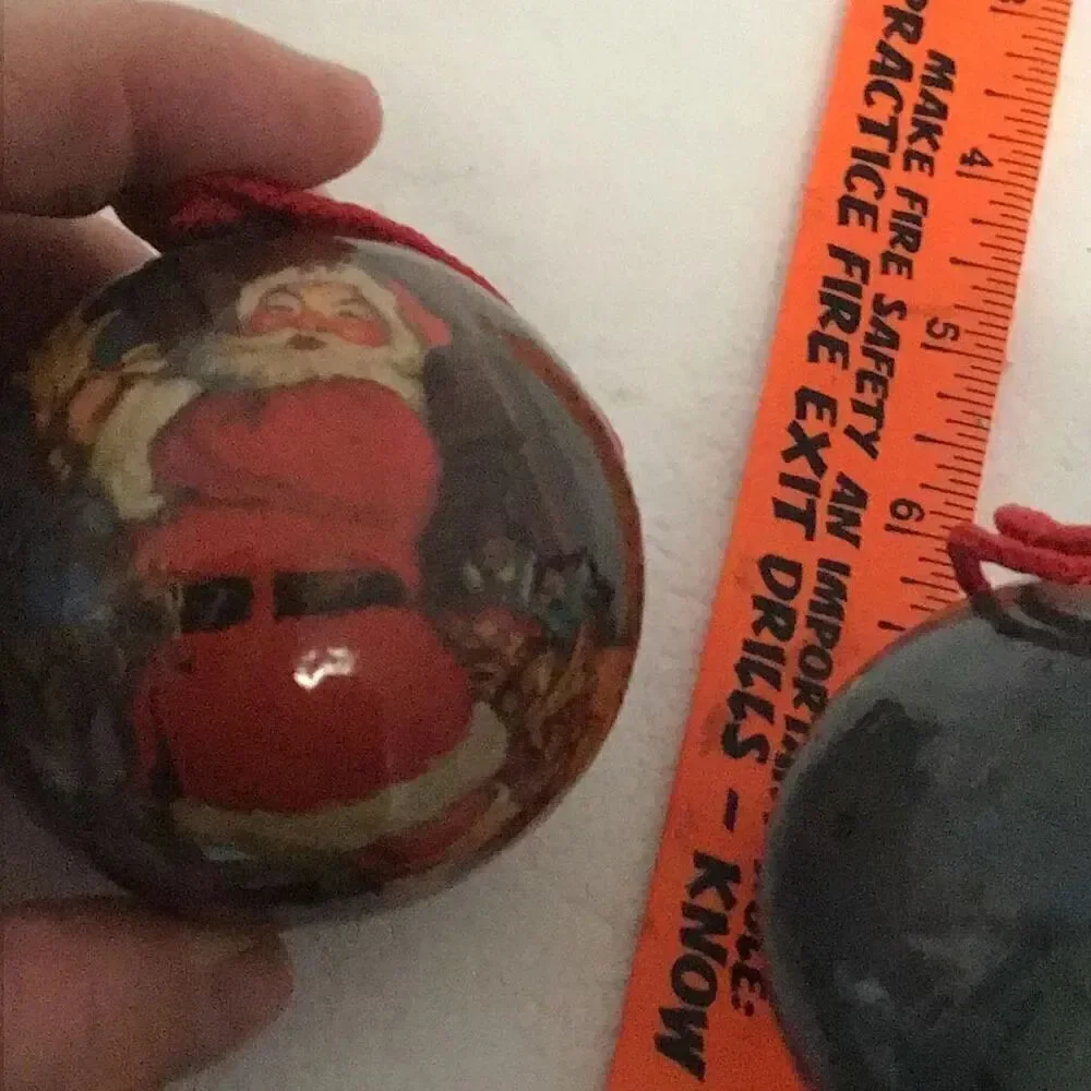 Pair of vintage paper ball Santa Christmas ornaments